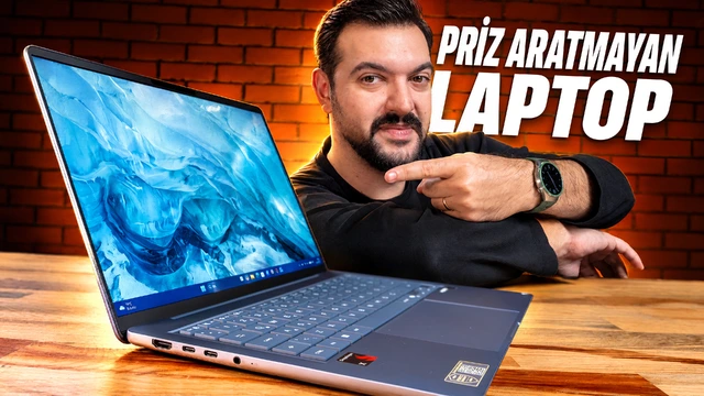 ASUS Zenbook 14 dizüstü bilgisayarın ve sunucunun yer aldığı inceleme görseli