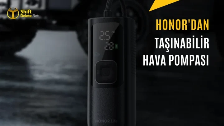 Honor Life Air Pump Lite taşınabilir hava pompası, karanlık zeminde lastiklerin yanında aydınlatma ışığıyla gösteriliyor