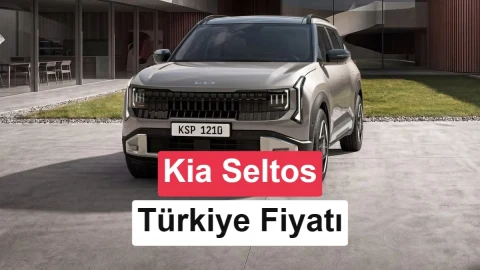 Kia Seltos gri SUV, modern bir binanın önünde görüntüleniyor