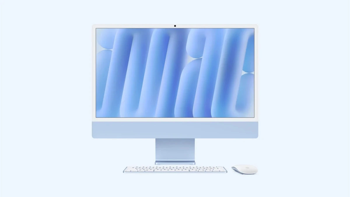 Ekranı açık, klavye ve faresinin yanında bulunduğu iMac