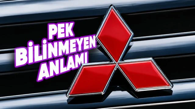 Mitsubishi’nin kırmızı üç elmaslı logosu, siyah ve gümüş renkli araç ızgarası üzerinde