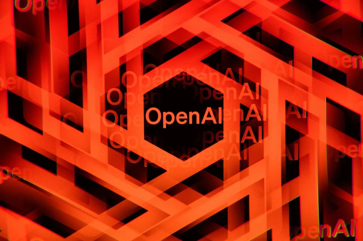 Kırmızı ve turuncu geometrik desenler arasında OpenAI yazısı