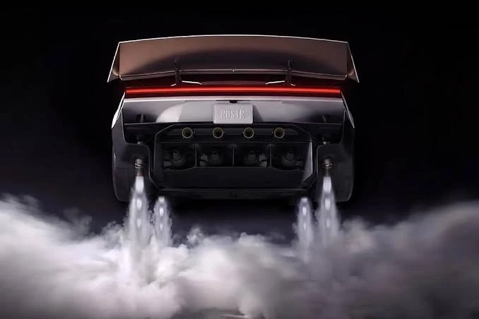 Gaz püskürten arka iticileri görünen Tesla Roadster