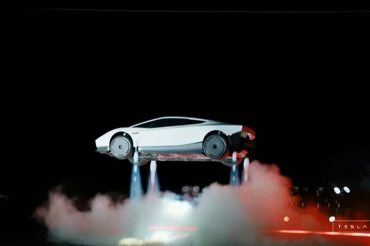 Azot iticileriyle havaya yükselmiş beyaz Tesla Roadster