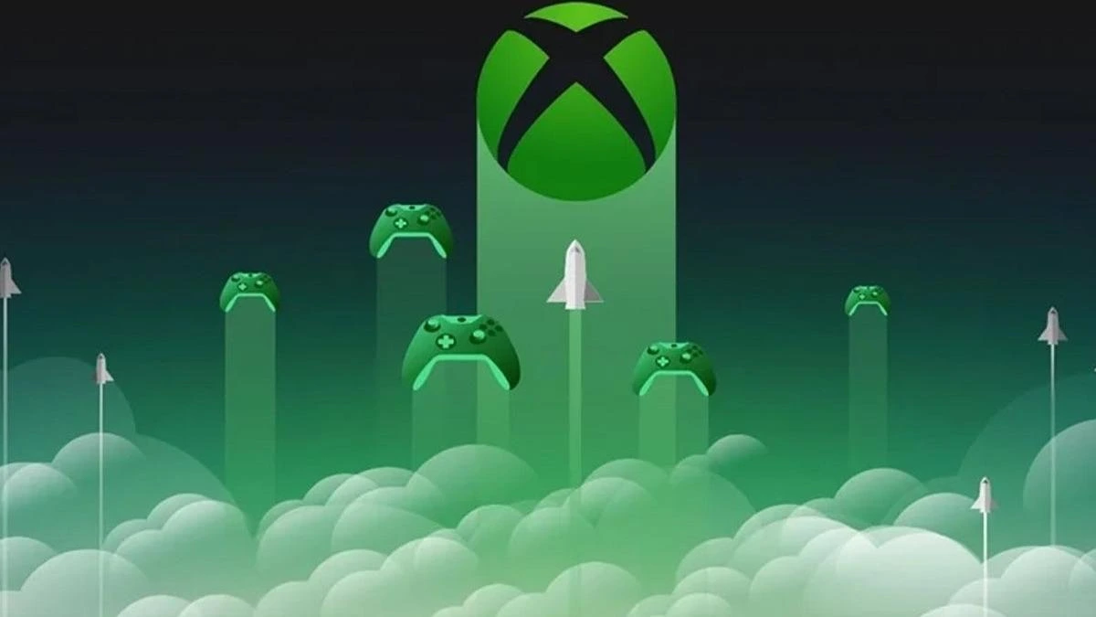 Xbox logosu ve bulutların üzerinde yükselen oyun kumandaları